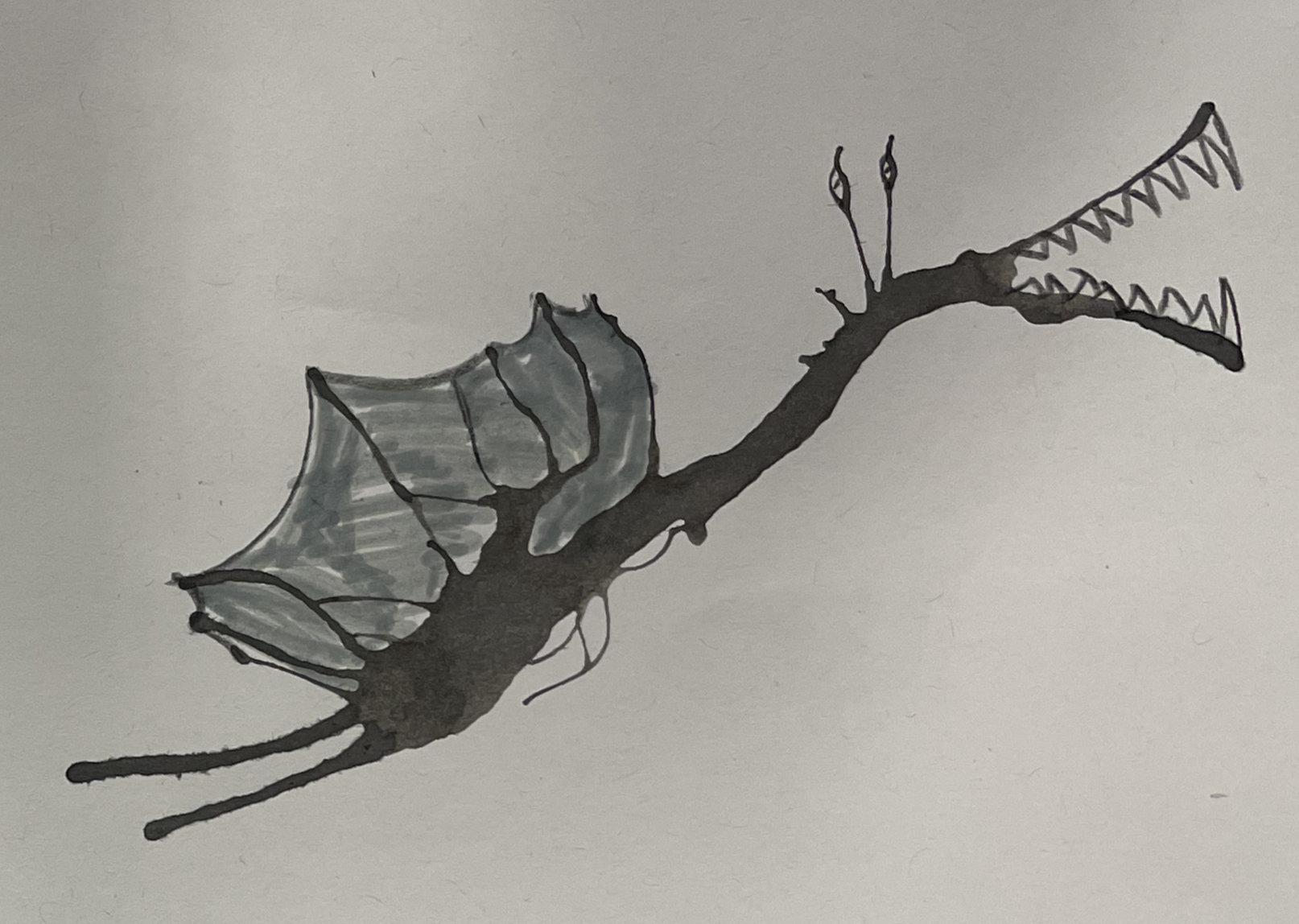 Ink Monster, a dragon design made from an ink blot drawn over with pen